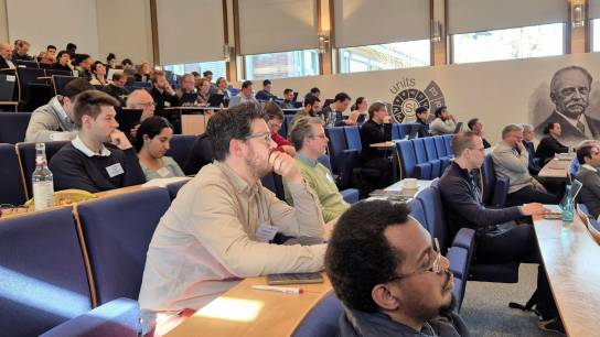 Participants listening to presentations